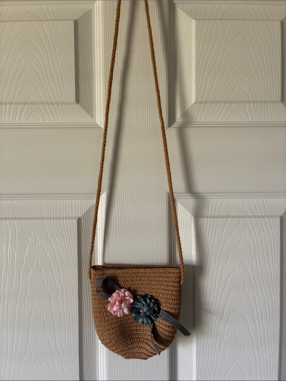 Handcrafted Brown Crossbody Bag with Floral Accent